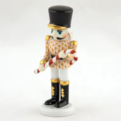 Small Nutcracker W/Candy Cane Butterscotch 2.25 in L X 1.25 in W X 4.25 in H