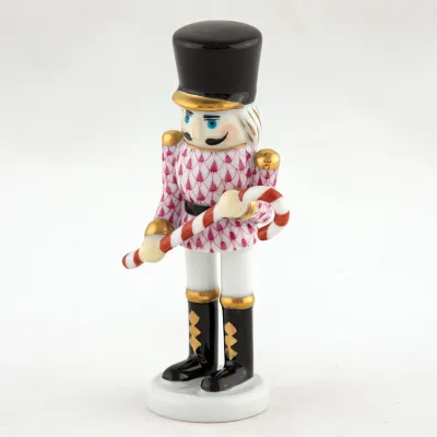 Small Nutcracker W/Candy Cane Raspberry 2.25 in L X 1.25 in W X 4.25 in H