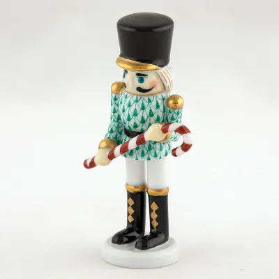 Small Nutcracker W/Candy Cane Green 2.25 in L X 1.25 in W X 4.25 in H