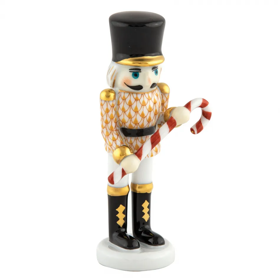 Small Nutcracker W/Candy Cane Butterscotch 2.25 in L X 1.25 in W X 4.25 in H