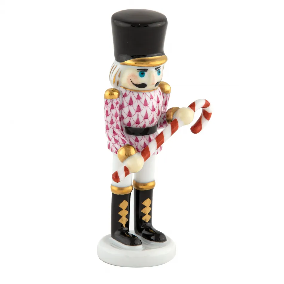 Small Nutcracker W/Candy Cane Raspberry 2.25 in L X 1.25 in W X 4.25 in H